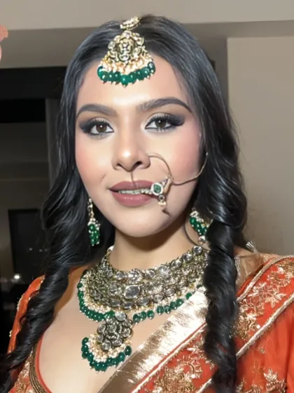 A happy reception bride, smiling for the camera. Her makeup is flawless, and her joy is infectious.