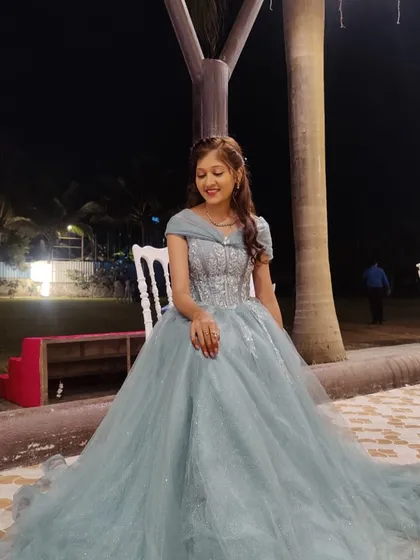 A princess moment in a beautiful pastel green ball gown. This is a perfect example of the stunning party wear gowns I offer for rent.