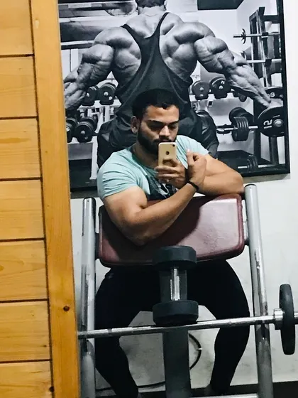 Taking a moment after a bicep workout. Progress might feel slow sometimes, but consistency is what brings results. This is the mindset we build together.