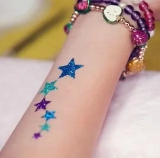 A simple yet beautiful trail of stars. This design looks great on the wrist or arm and can be created in any color combination.
