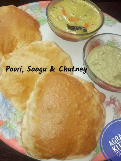 A plate of hot, puffy Pooris served with vegetable Saagu and coconut chutney. This is a perfect weekend breakfast treat that I can deliver right to your doorstep.