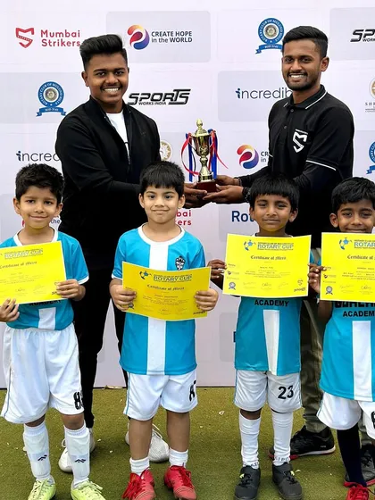 Our youngest competitors, the Under-7 team, receiving their bronze medal trophy and certificates. A great start to their football journey.
