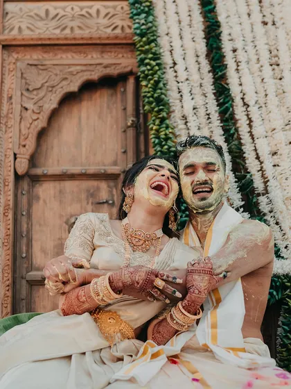 While I love grand gestures, the real magic is in the unscripted moments. This candid shot from a South Indian Haldi ceremony captures the pure, uninhibited laughter between the couple, a memory they will cherish forever.