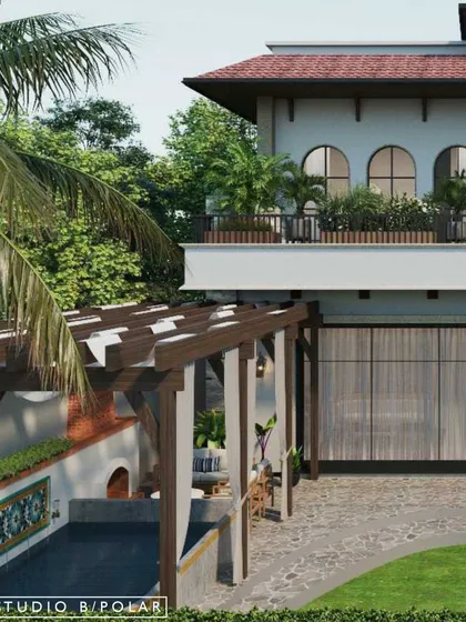 A detail of the villa's exterior, highlighting the wooden pergola over the driveway and the lush greenery that surrounds the home, creating a welcoming and picturesque entrance.