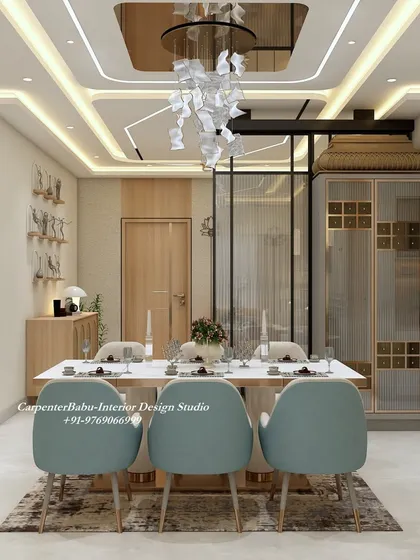 An open-concept dining area that feels grand and spacious. The statement chandelier and glass partition create a sense of luxury, while the light wood tones keep it feeling warm and inviting.