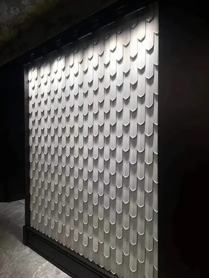 A unique fish-scale or feather-like patterned wall panel. This 3D design adds a soft, textured look and is perfect for creating a unique feature wall.