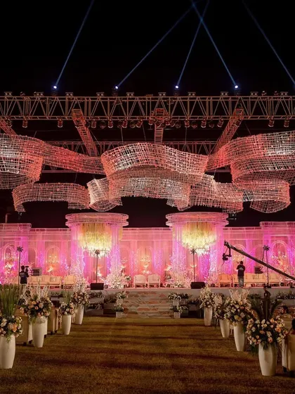 This is what I mean by building experiences. We transformed a 50,000 sq ft lawn into a palatial wonderland with an 80-foot custom stage and breathtaking crystal installations, all executed in just one and a half days for a grand reception in Mumbai.