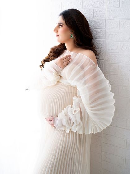 A beautiful and soft portrait using a textured wall and natural light. I'll teach you how to find and use light to create flattering and gentle images.