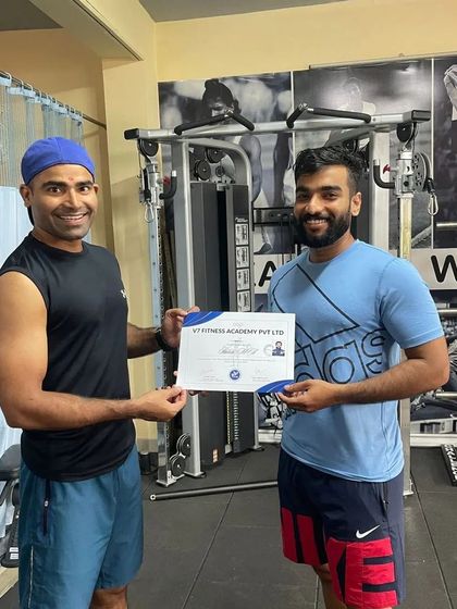 Presenting a certificate of completion for our Olympic lifting course. It's rewarding to see dedicated individuals invest in their education and professional growth.