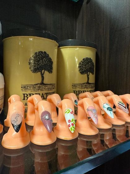A look at some of our intricate nail art designs on display. We use these practice fingers to showcase different techniques and provide inspiration for your next set.