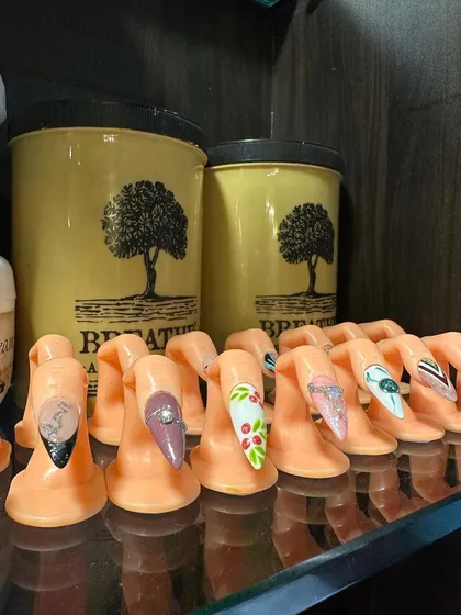 A look at some of our intricate nail art designs on display. We use these practice fingers to showcase different techniques and provide inspiration for your next set.