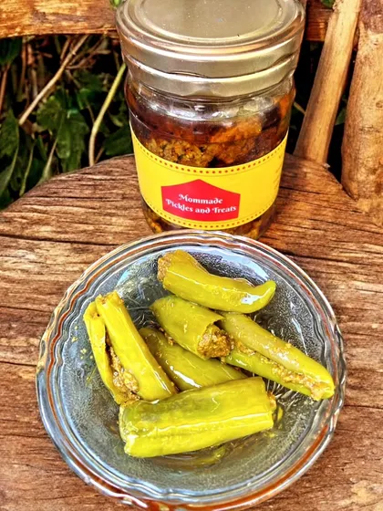 For those who love a bit of spice, I make this Stuffed Hari Mirchi Achaar. Each green chilli is carefully slit and filled with a tangy masala mix before being pickled. It has a wonderful crunch and a fiery kick that really livens up a meal.