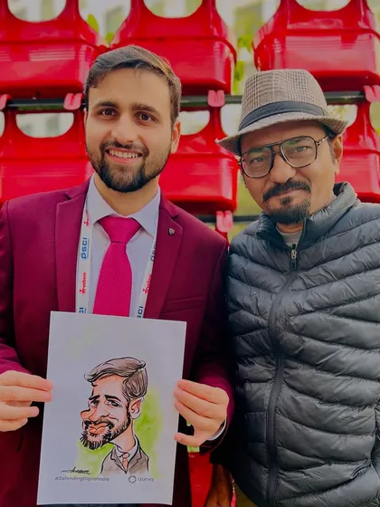 A proud guest holding his caricature at the Aurva corporate event. It’s always a pleasure to bring an artistic twist to professional gatherings.