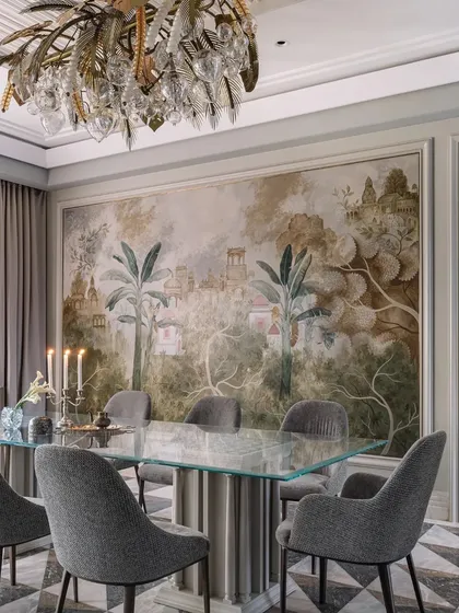 The dining room features a stunning hand-painted wall mural depicting a fantastical landscape, creating a unique and immersive dining experience.