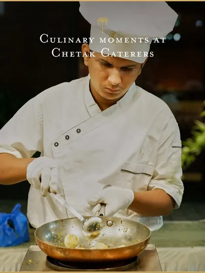 A chef carefully sautés ingredients in a pan at a live counter. This image highlights the focus and precision our culinary team brings to crafting each dish to perfection for your guests.