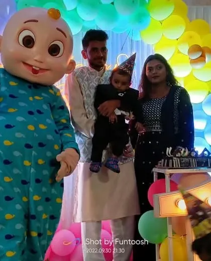 The family celebrating with the Cocomelon mascot during the cake cutting ceremony. These are the happy moments we love to create.