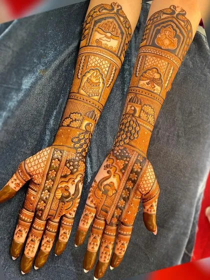 A classic design with palace architecture, peacocks, and intricate filler patterns, perfect for a traditional bride.