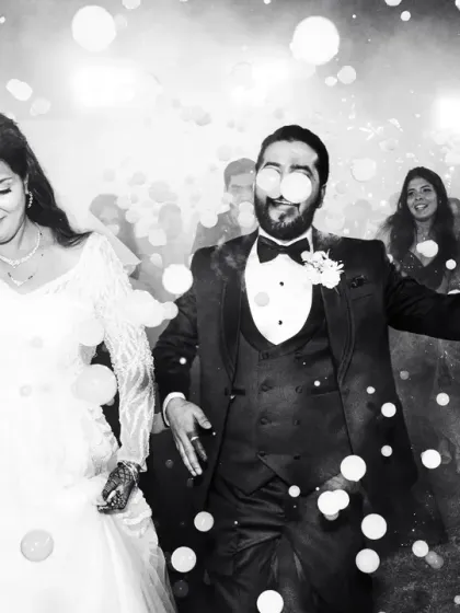 A fun, energetic reception entrance with bubbles floating all around the happy couple. This black and white shot feels timeless and full of life.
