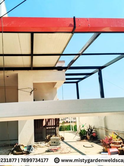 A work-in-progress shot of a 30mm puff sheet pergola installation in KR Puram. The heavy-duty metal structure is designed to provide maximum strength and support for the insulated roofing, ensuring a durable and cool outdoor space.