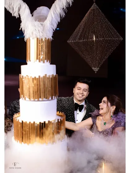 The grand cake-cutting ceremony, complete with dramatic smoke effects. This highlights our focus on capturing the spectacular details and celebratory highlights of your reception.