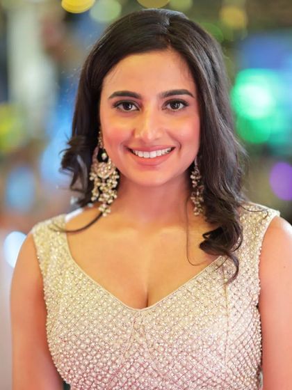 A close-up portrait of Shivani Rai, capturing her happy and relaxed demeanor at the event.