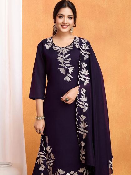 A wine-colored vichitra silk kurta with beautiful silver thread embroidery. The leaf motifs give it a unique, nature-inspired touch.