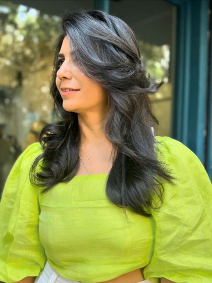 Another angle of this gorgeous layered haircut. The style is designed to be low-maintenance while looking effortlessly chic, showing off the healthy, flowing locks.