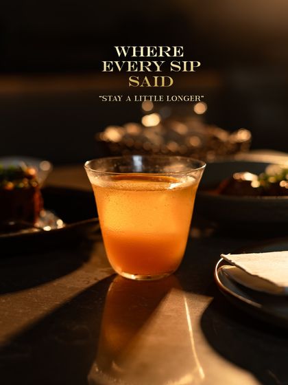Every sip should be an invitation to stay a little longer. This cocktail, glowing in the low light, is crafted to be savored, offering a complex taste that unfolds with time. It is part of the afterglow experience.
