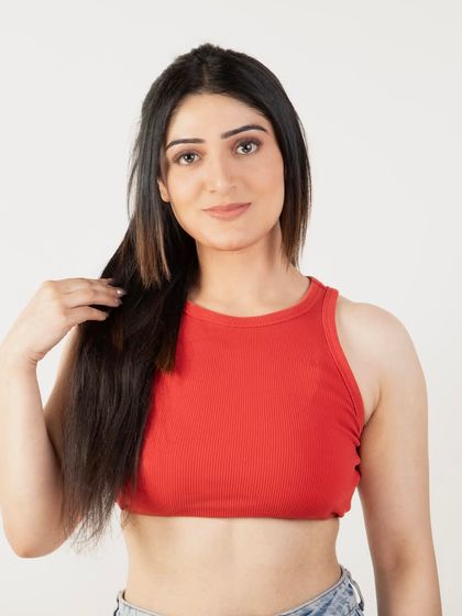 A model with long, flowing hair extensions, demonstrating the length and quality of the product in a simple, elegant portrait.