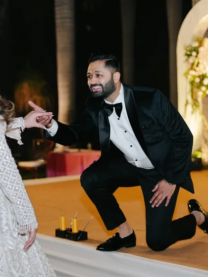 A groom's heartfelt gesture during their performance. It's these small, personal touches that make a dance truly special.