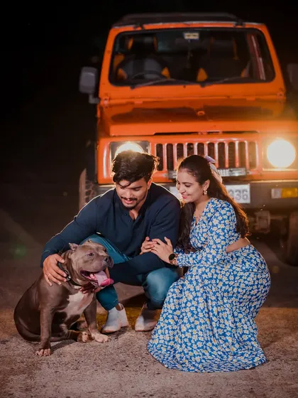 Including your furry friend in your pre-wedding shoot makes it even more special. This couple shared a moment with their beloved American Bully during a cool night shoot with a jeep.