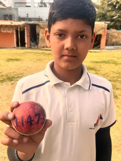 Jatin, one of our promising bowlers, holding the ball after a brilliant performance. His hard work in the nets is clearly paying off.