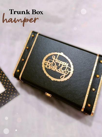 A clean, simple shot of the black and gold Trunk Box, highlighting its classic design and sturdy hardware.