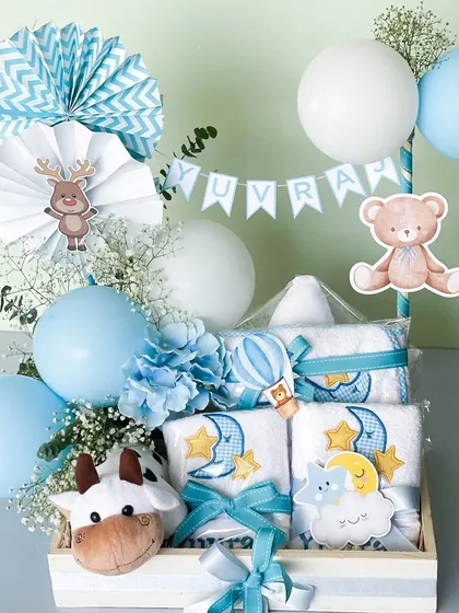 A closer look at a baby boy hamper, featuring a personalized name banner for Yuvraj, cute animal toys, and carefully arranged baby essentials. Every detail is chosen to create a delightful surprise.