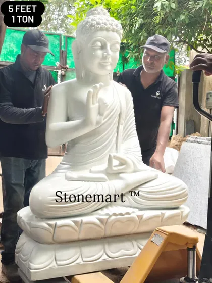 Here our team carefully handles a monumental 5-foot, 1-ton Buddha statue. This demonstrates the scale and substance of our work, as each large garden Buddha statue is carved from a solid block of white marble for unmatched durability and presence.