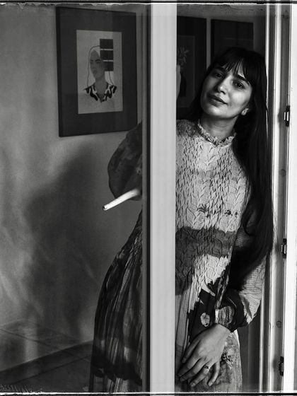 Devanshi, peeking from behind a door. Her gentle smile and the soft light make this a warm and inviting portrait from my 'Doorways' series.