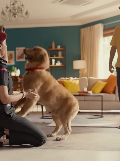 Even in uniform, the character's personal life shines through. This scene with her dog required styling that was practical for movement while maintaining the crisp look of her army attire.