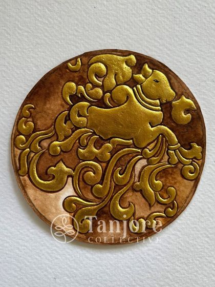 A contemporary take on a traditional subject, this Nandi is created with beautiful embossing and gold work on a textured background.