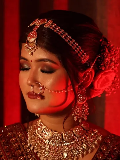 A powerful and artistic shot highlighting the bride's eye makeup. The deep, smokey look adds a touch of drama and sophistication to her wedding day glam.