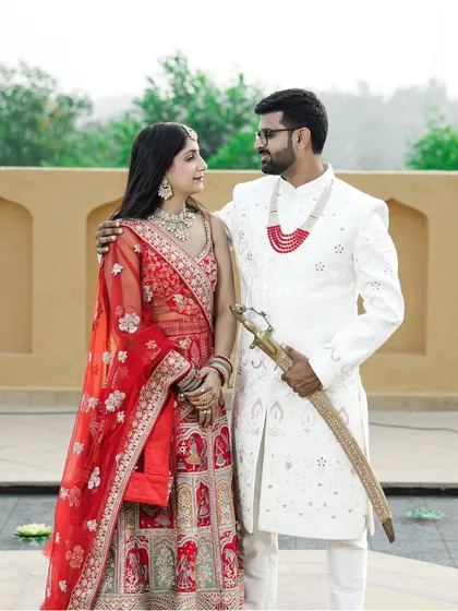Celebrating your roots is beautiful. This portrait captures the regal elegance of traditional Indian attire. The rich colors of the lehenga and sherwani against a classic backdrop make for a truly timeless pre-wedding photograph.