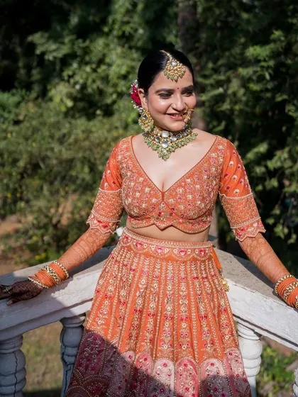A happy, smiling bride. The makeup is soft and pretty, enhancing her natural beauty without being too heavy.