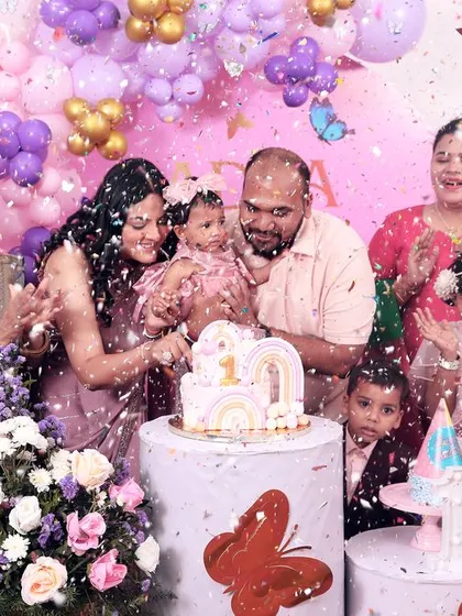 The big moment! We make sure to capture the excitement of the cake cutting, complete with a shower of confetti and cheers from the whole family.
