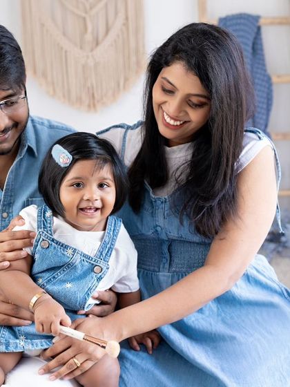 Tender smiles and moments to be replayed again and again. This family, dressed in denim, shares a sweet and happy moment.