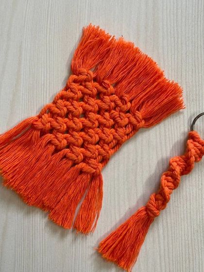A matching set of a vibrant orange coaster and a spiral keychain, a perfect combo for a small gift.