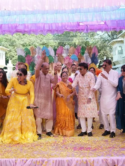 The entire family on stage, dancing together. These moments of collective celebration are what Indian weddings are all about.