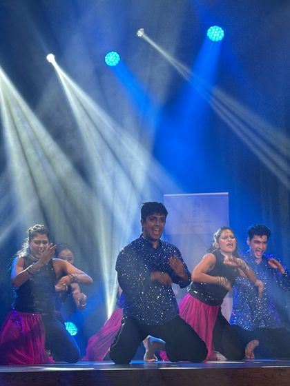 A dynamic group performance with coordinated costumes and high energy moves. This is the kind of synchronized and exciting dance we can create for your friends and family at a wedding event.