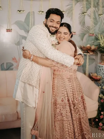 A warm hug between the couple. We love being a part of these special days and ensuring our clients look and feel their best.