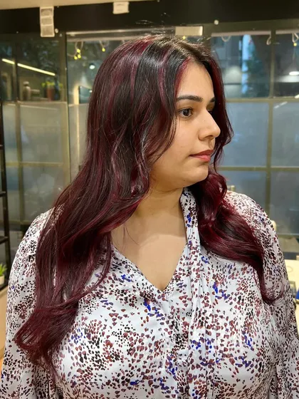 A side profile of the cherry red hair, showing how the color frames the face and brightens the complexion.
