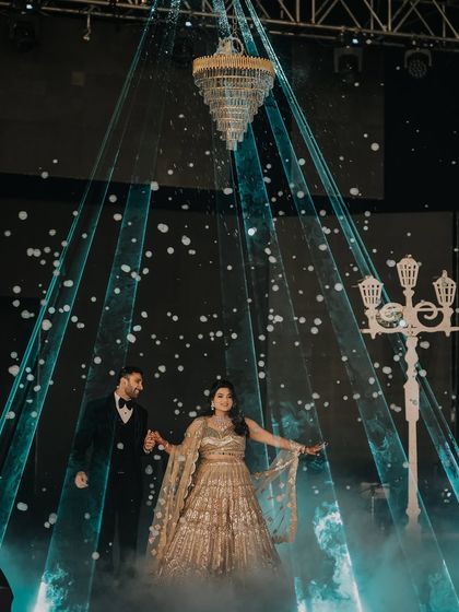 A fairytale entrance for the ring ceremony. The couple makes their way through dramatic laser lights and a bubble shower, a truly magical moment that I captured to look like a dream.
