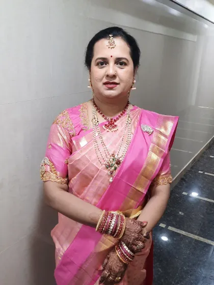 A lovely look for a 'varapooja' ceremony. I chose a pink-toned palette for her makeup to match her beautiful saree, creating a soft and feminine look.
